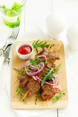 Beef shish kebab  on skewers in curry.