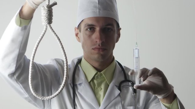 The doctor offers a choice between a noose and a medicine. The choice between suicide or treatment.