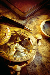 Fototapeta na wymiar Old vintage compass and travel instruments on ancient map
