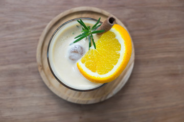 Black coffee with lemon on the wood background. 