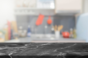 Stone table top and blurred kitchen interior background - can used for display or montage your products.