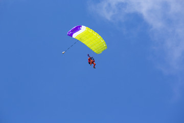 Parachute man landing down.