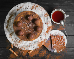 Chocolate cake covered with cocoa powder