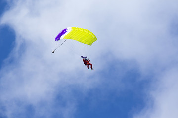 Parachute man landing down.