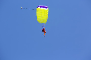 Parachute man landing down.