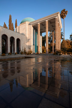 Tomb of Saadi in Shiraz Reflected on Wet Floor on a Sunny Day with Warm Filter