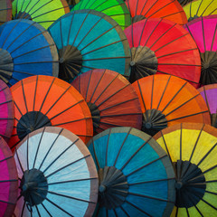 Colorful paper umbrellas on the market. Laos