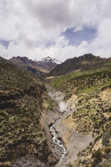Fumarole, hot sulfurous gases emerge from earth near a Peruvian volcano.
