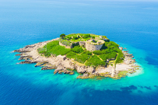 Top view of the island with a fortress in the sunlight