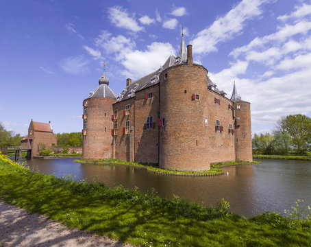 Big brick, medieval castle Ammersoyen surrounded by a moat on abeautiful spring day
