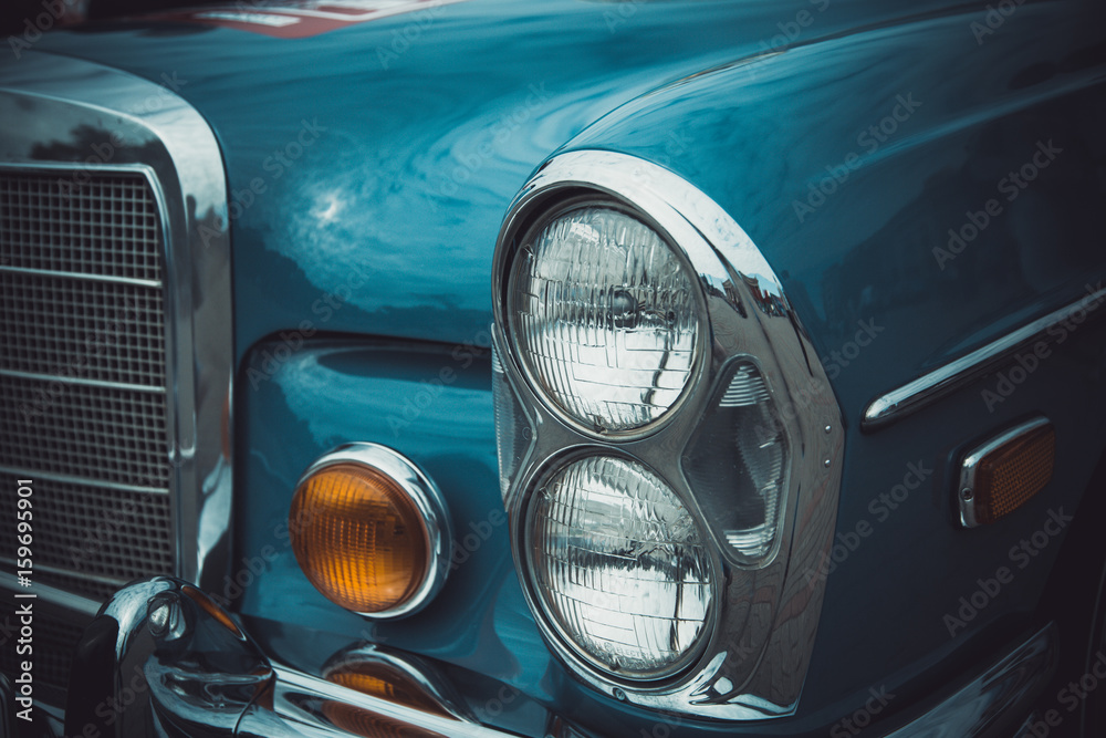 Wall mural Headlights and body of an old classic car at an exhibition of vintage cars