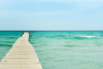 Fototapeta premium View from a wooden pier over the ocean