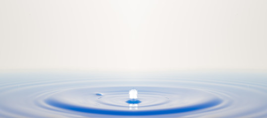 A blue water drop in photos.