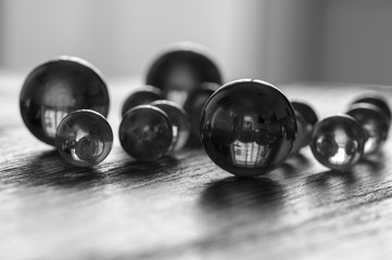 Black white photo with glass balls. Glass balls of different sizes. Selective focus.