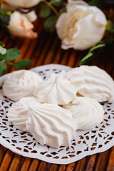 White homemade zephyr or marshmallow on wooden background