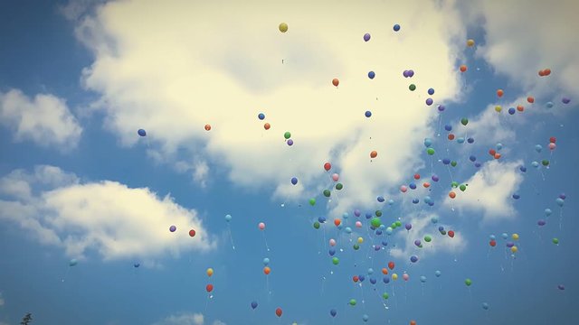 Colorful ballons flying upwards