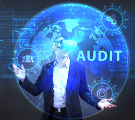 The concept of business, technology, the Internet and the network. A young entrepreneur working on a virtual screen of the future and sees the inscription: Audit