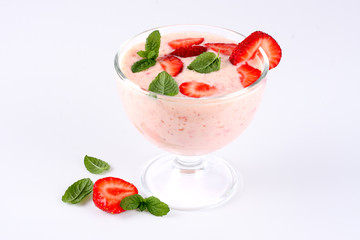  Healthy strawberry yogurt with mint leaves and fresh berries isolated on white background