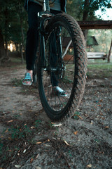 Fototapeta na wymiar Mountain bike on a forest road in the evening.