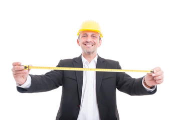 Smiling architect posing holding measuring tape