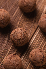 Chocolate truffles on wooden background
