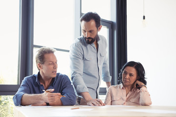 Fototapeta premium middle aged business team talking while working at office