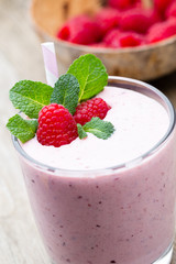 Raspberry milk shake with mint decor.
