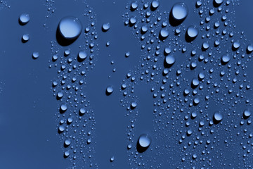 Raindrops on blue surface, background