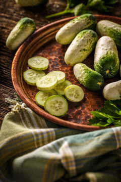 Whole and sliced cucumbers