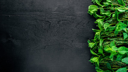 Fresh mint and herbs. On Wooden background. Top view. Free space.