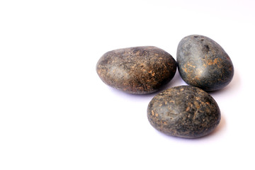Fototapeta na wymiar Three stones on isolated white background
