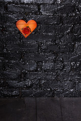 Wooden heart on a black background