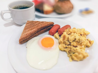 Breakfast with coffee and fresh bread on table