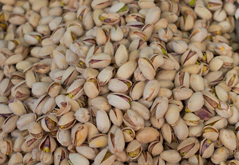 Pistachios for sale on market. Agriculture background. Top view. Close-up