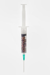 Coffee beans in syringe