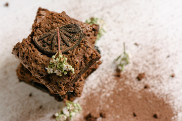 Chocolate brownies, with black biscuit stuffed with cream