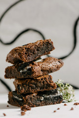 Chocolate brownies, with black biscuit stuffed with cream
