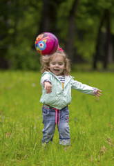 Little girl playing ball