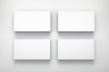 Mockup of four business cards on white textured paper studio. High resolution 3d render.