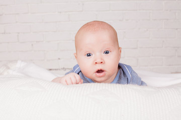 Portrait of a baby with a baby in a white room