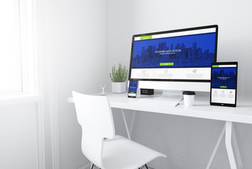 Fototapeta na wymiar devices on white minimal workspace responsive cool and modern website