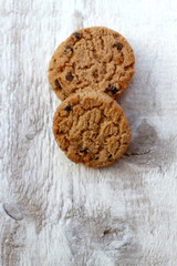 Chocolate chip cookies on white rustic table. Selective focus.