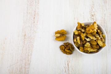 Walnuts on a  wooden table