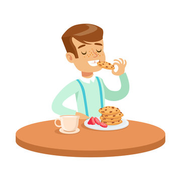 Happy Boy Sitting At The Table And Eating Cookies, Colorful Character Vector Illustration