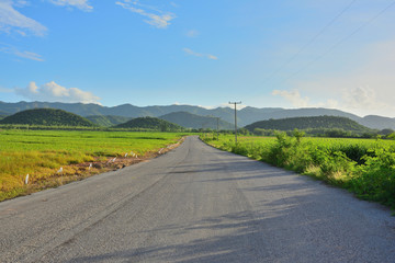 Naklejka premium Life was faced obstacles ahead, we need to get through it.Country road to the Mountain natural landscape,Tropical of rural in Thailand.