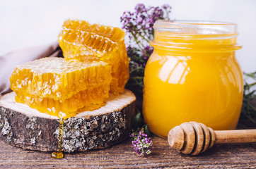 Honeycombs and glass pot with honey - Powered by Adobe