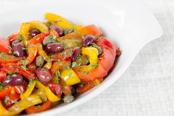 Peppers with olives and capers, close-up