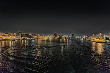Fototapeta premium Night view of Piraeus harbourr in Athens, Greece
