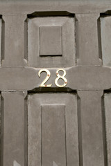 House number 28 sign on door