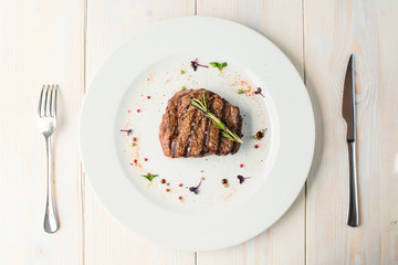 table setting with cooked beef steak